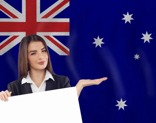 A young women showing Flag Of Australia - How to get PR in Australia