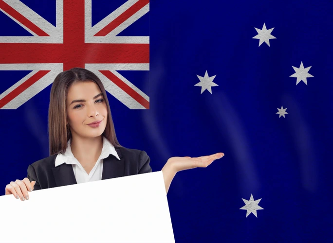 A young women showing Flag Of Australia - How to get PR in Australia