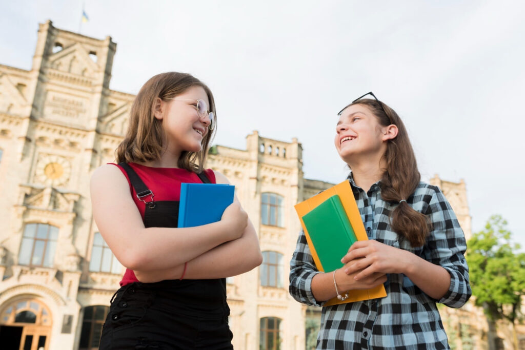 Two happy faces foreign students pursuing affordable study abroad program in uk