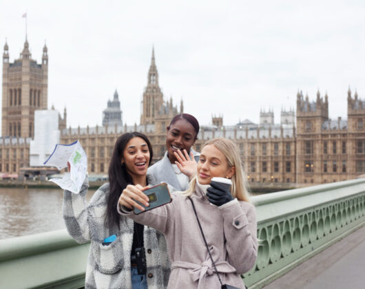 three foreign students pursuing Affordable Study Abroad Programs in the UK